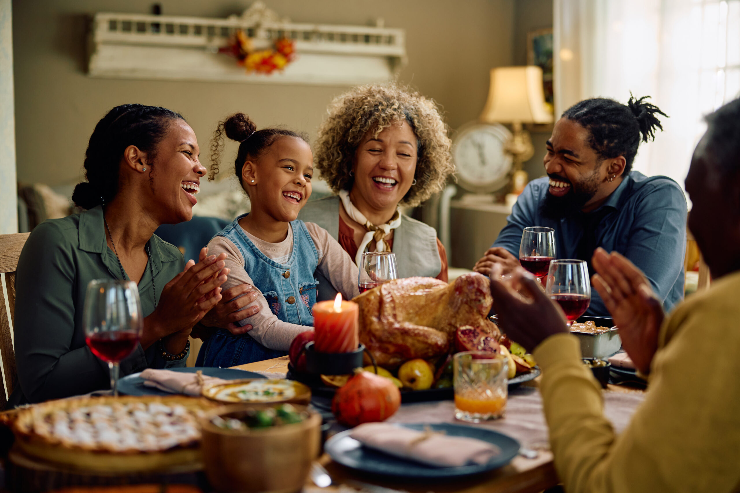 Cheerful family eating Thanksgiving dinner