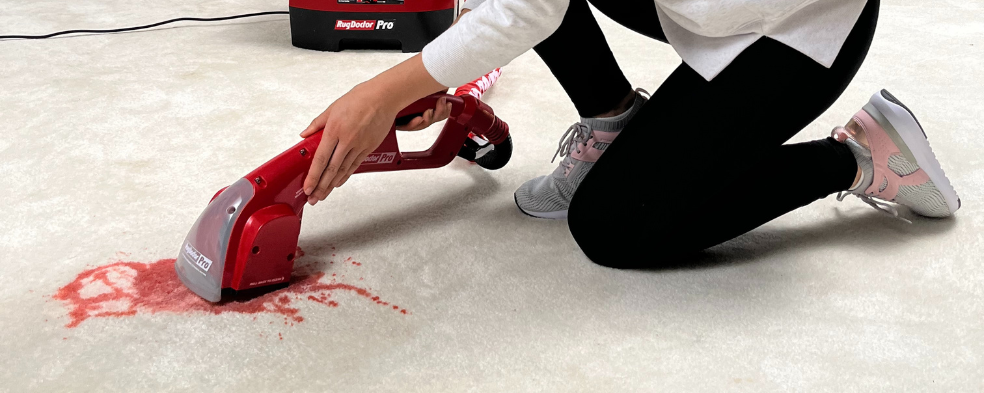 Cleaning red wine stain out of white carpet with RugDoctor Pro hand tool