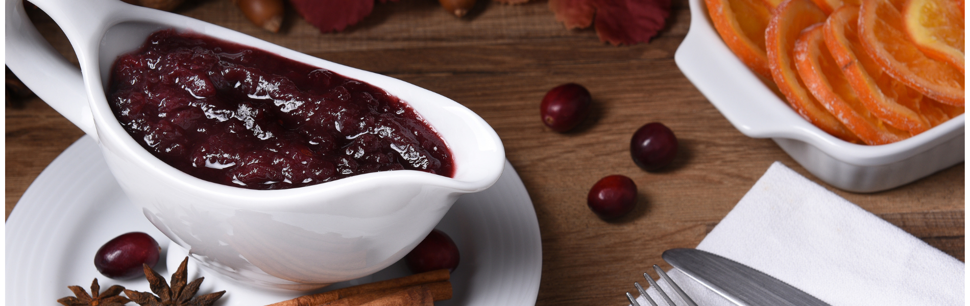 A serving dish of deep red cranberry jam.
