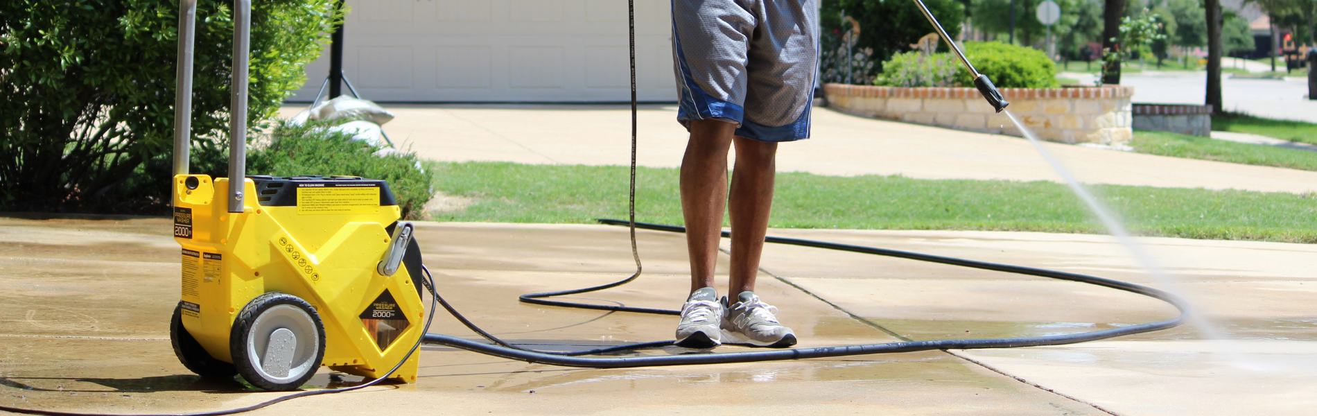 Using the RugDoctor pressure washer to clean the driveway